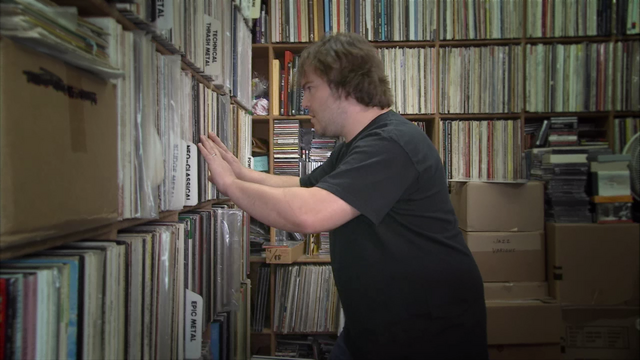 View the full-size Brütal Legend opening cutscene with Jack Black browsing records