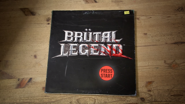 View the full-size Brütal Legend title screen presented as a record sleeve